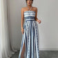 👗💙 אוברול גיאומטרי עם מחשוף הלטר וחתך בצד – 50% הנחה! מושלם לחוף, למשרד ולערב. 🔥✨